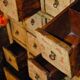 Antique Chinese apothecary cabinet with calligraphy