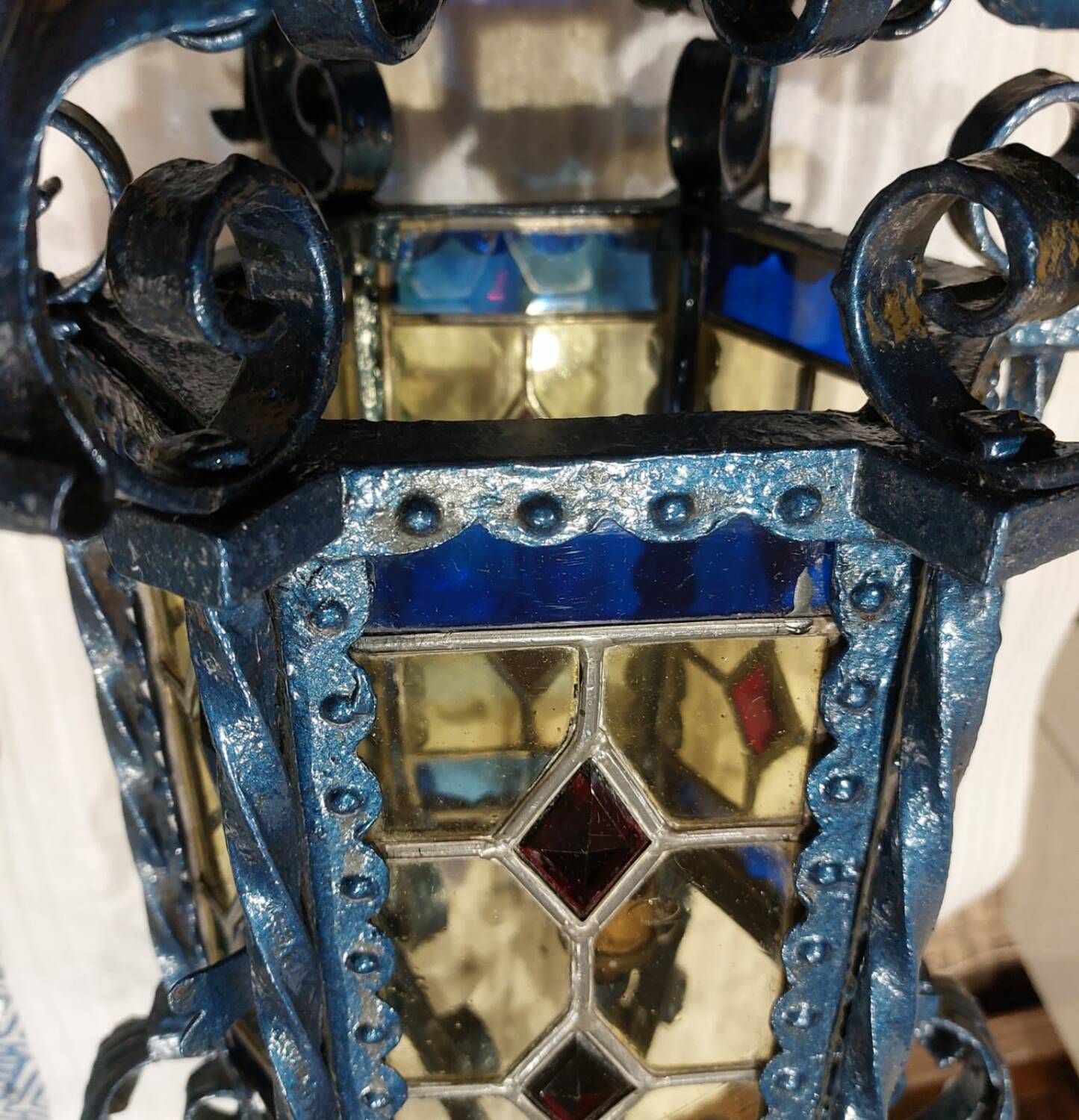 Large antique wrought iron lantern with stained glass windows