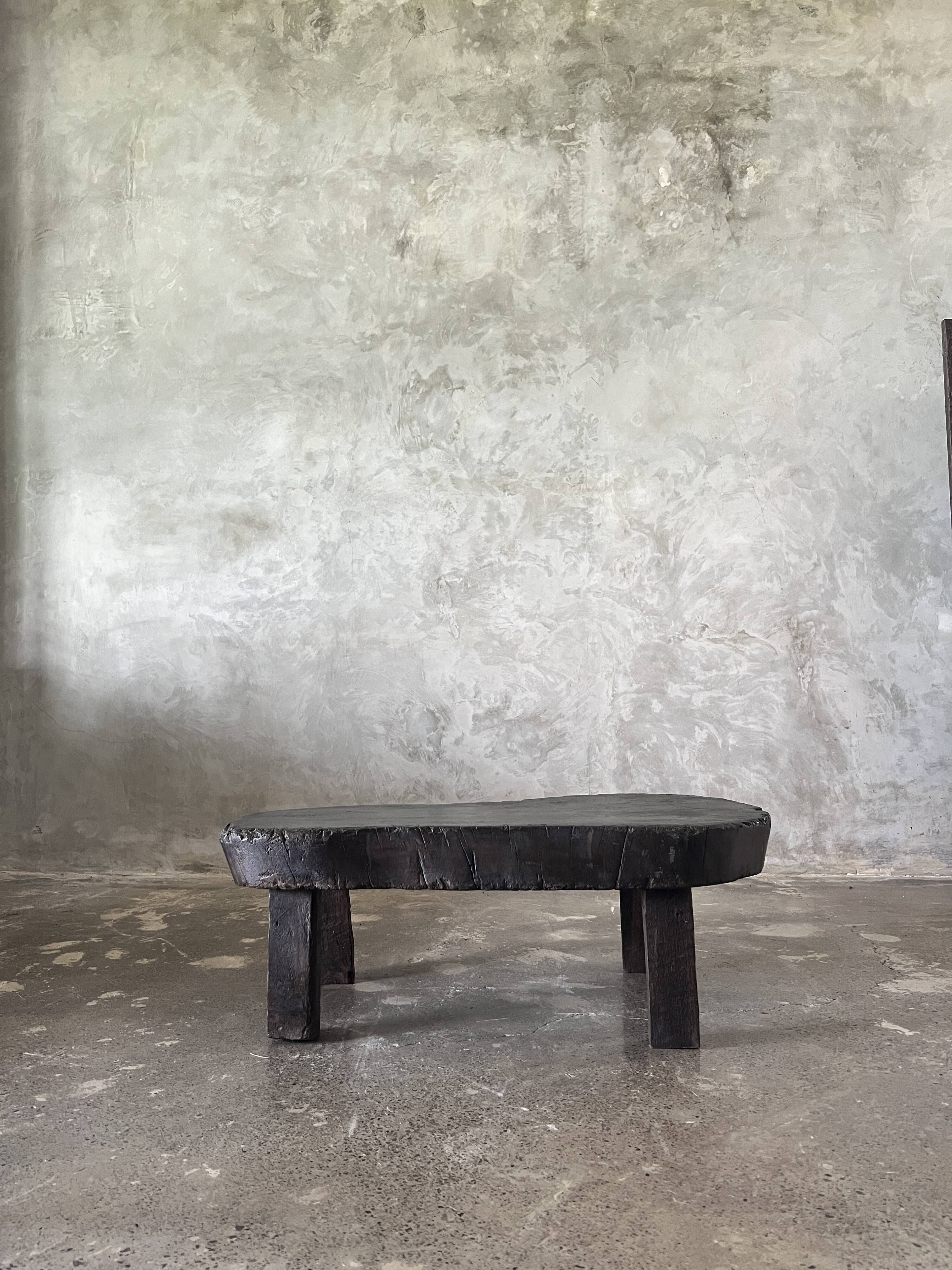 Small old Asian wooden coffee table in Japanese style, kidney-shaped top