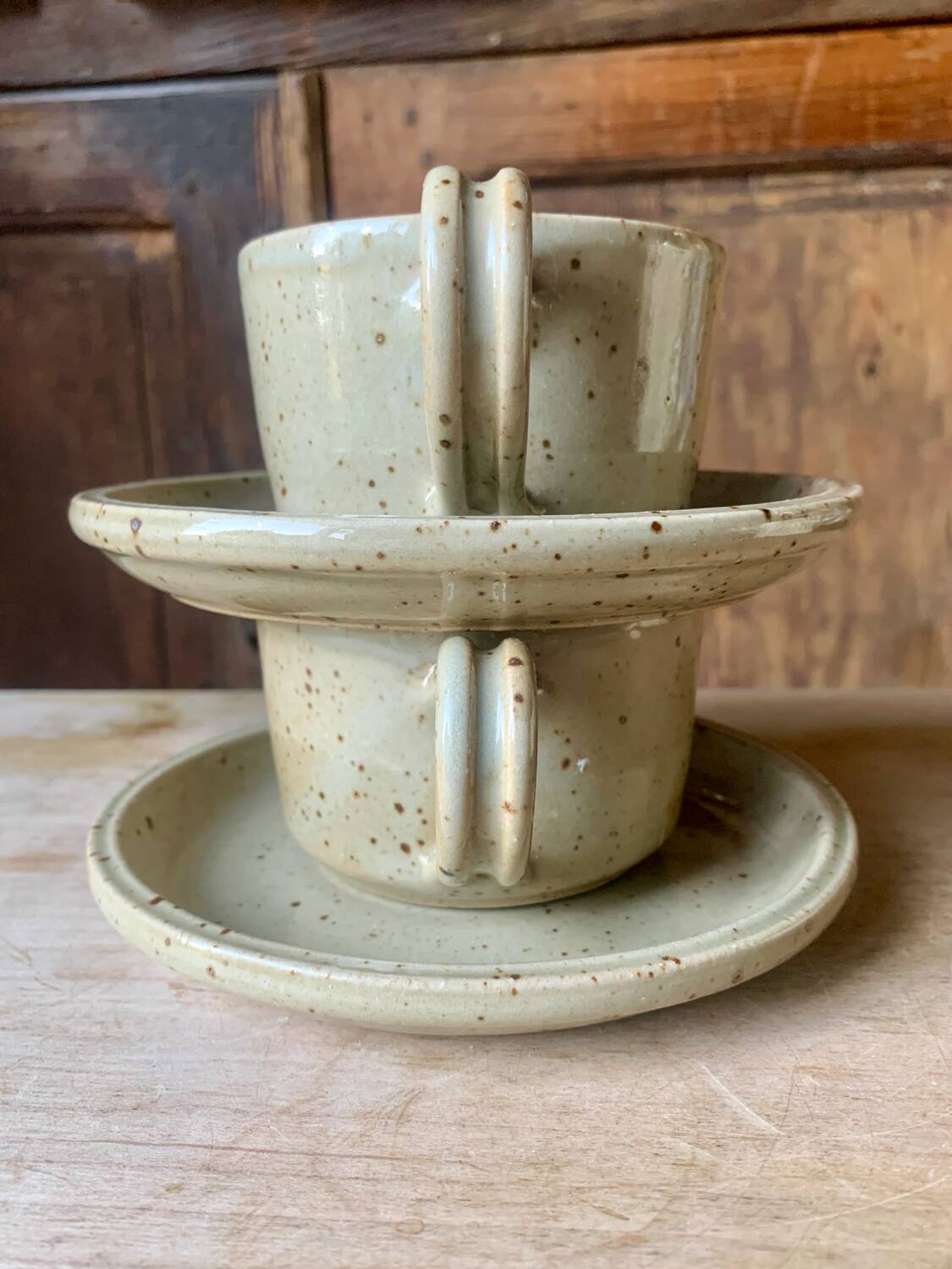 Two large Jean Austruy stoneware cups and saucers