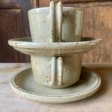Two large Jean Austruy stoneware cups and saucers