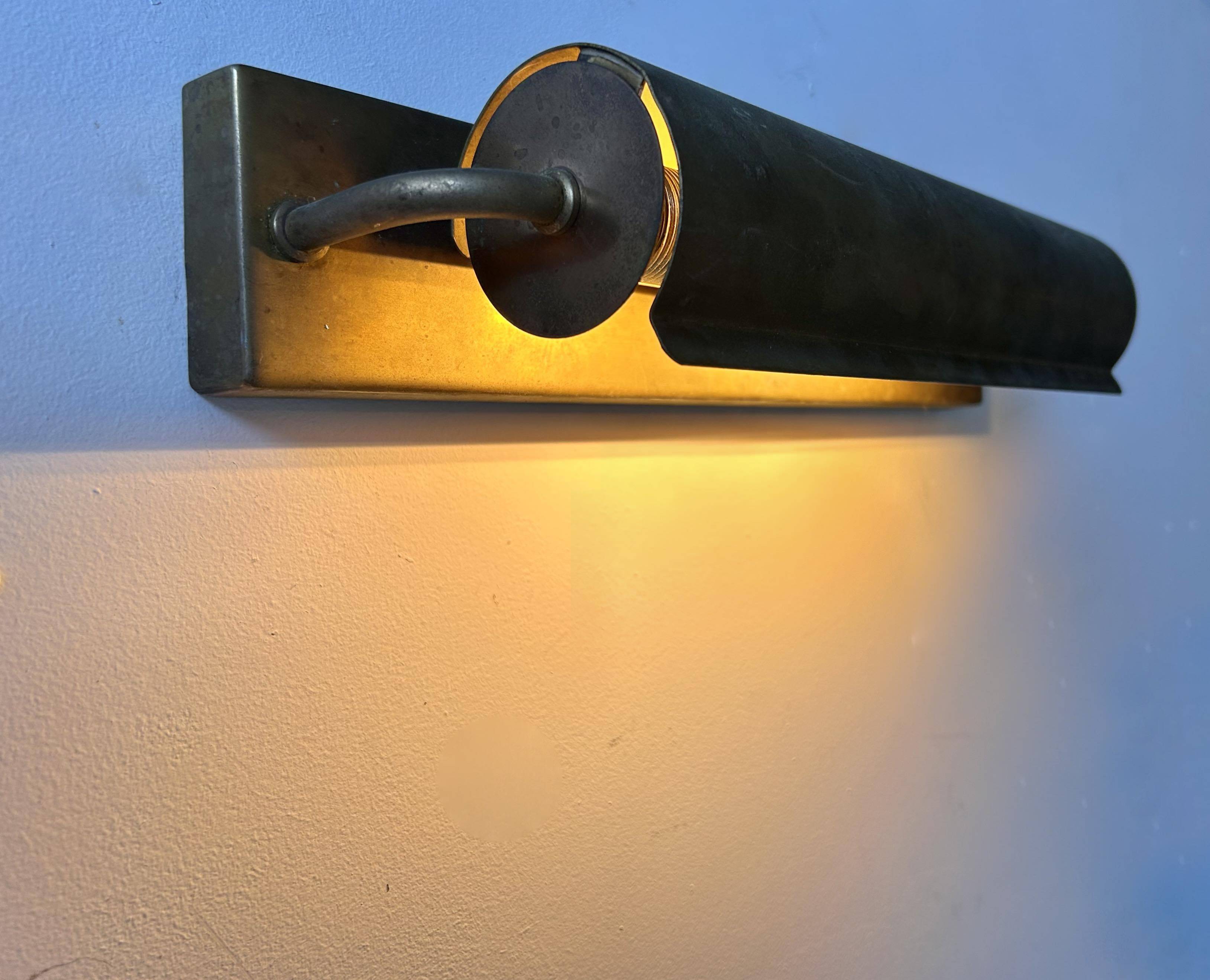 Modernist solid brass wall light, France 1940
