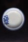 Antique shallow dish from Badonviller with blue flower decoration.