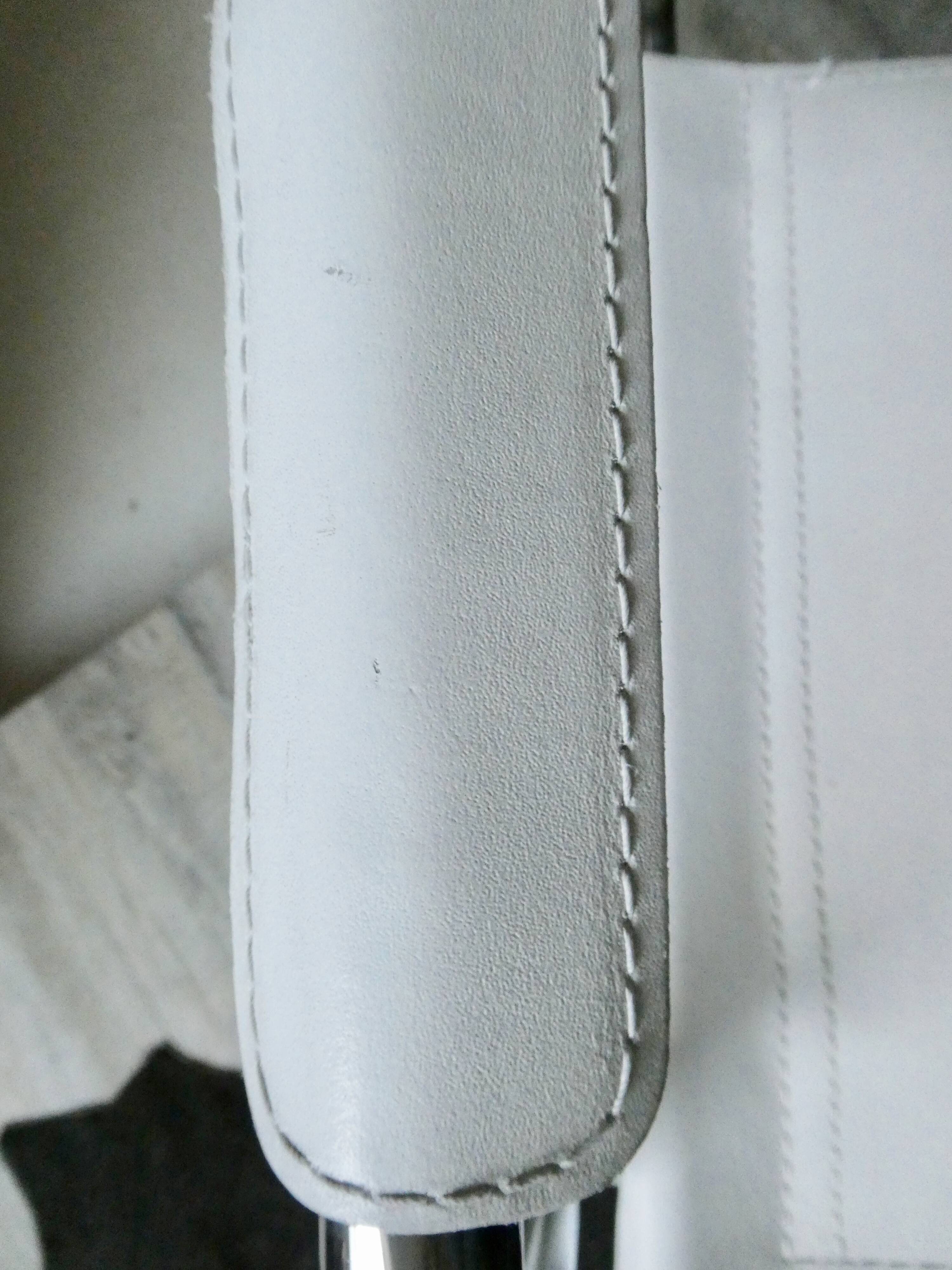 Armchair in chrome and leather