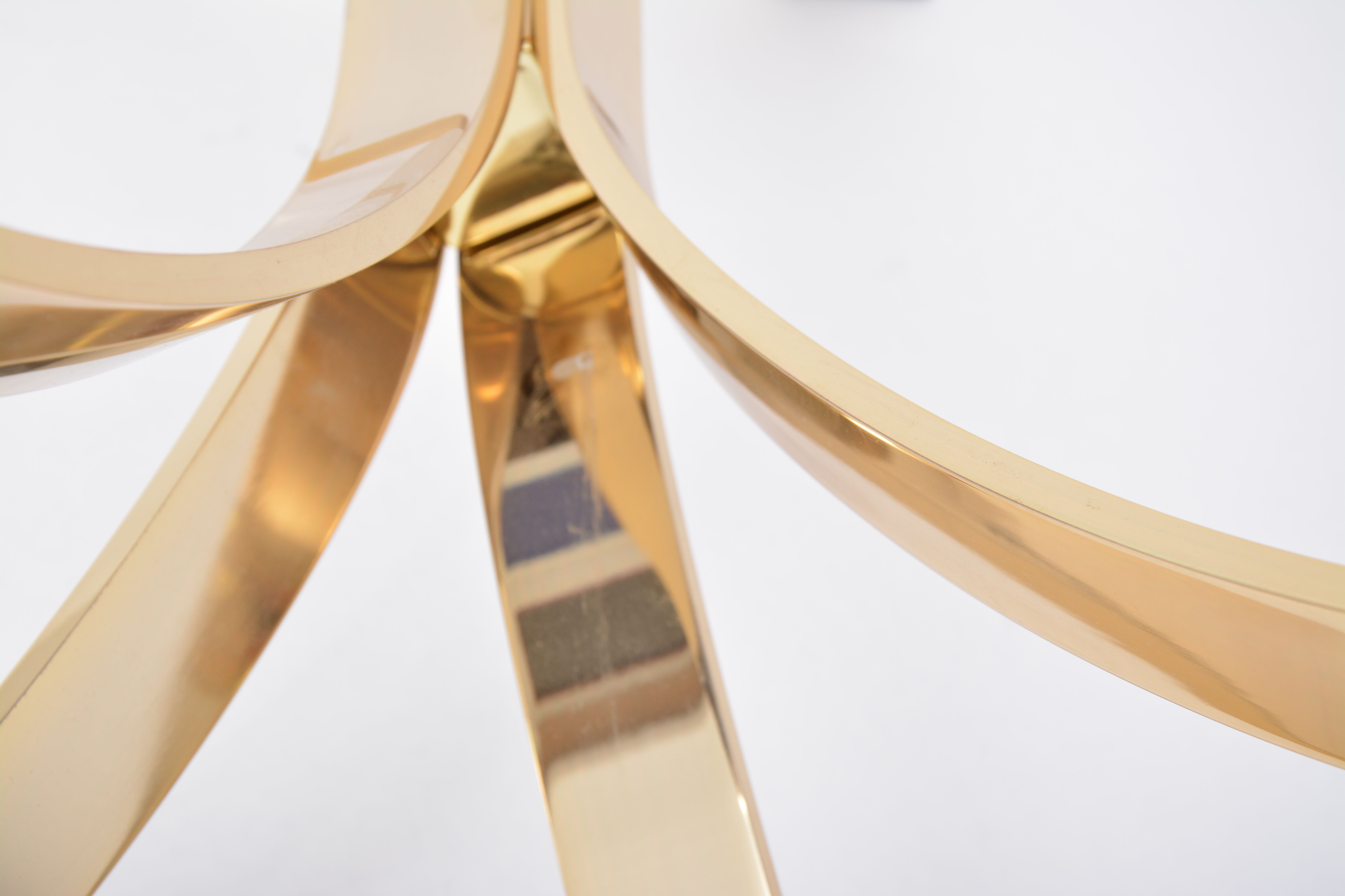 Gold Colored Mid-Century Modern coffee table with smoked Glass top