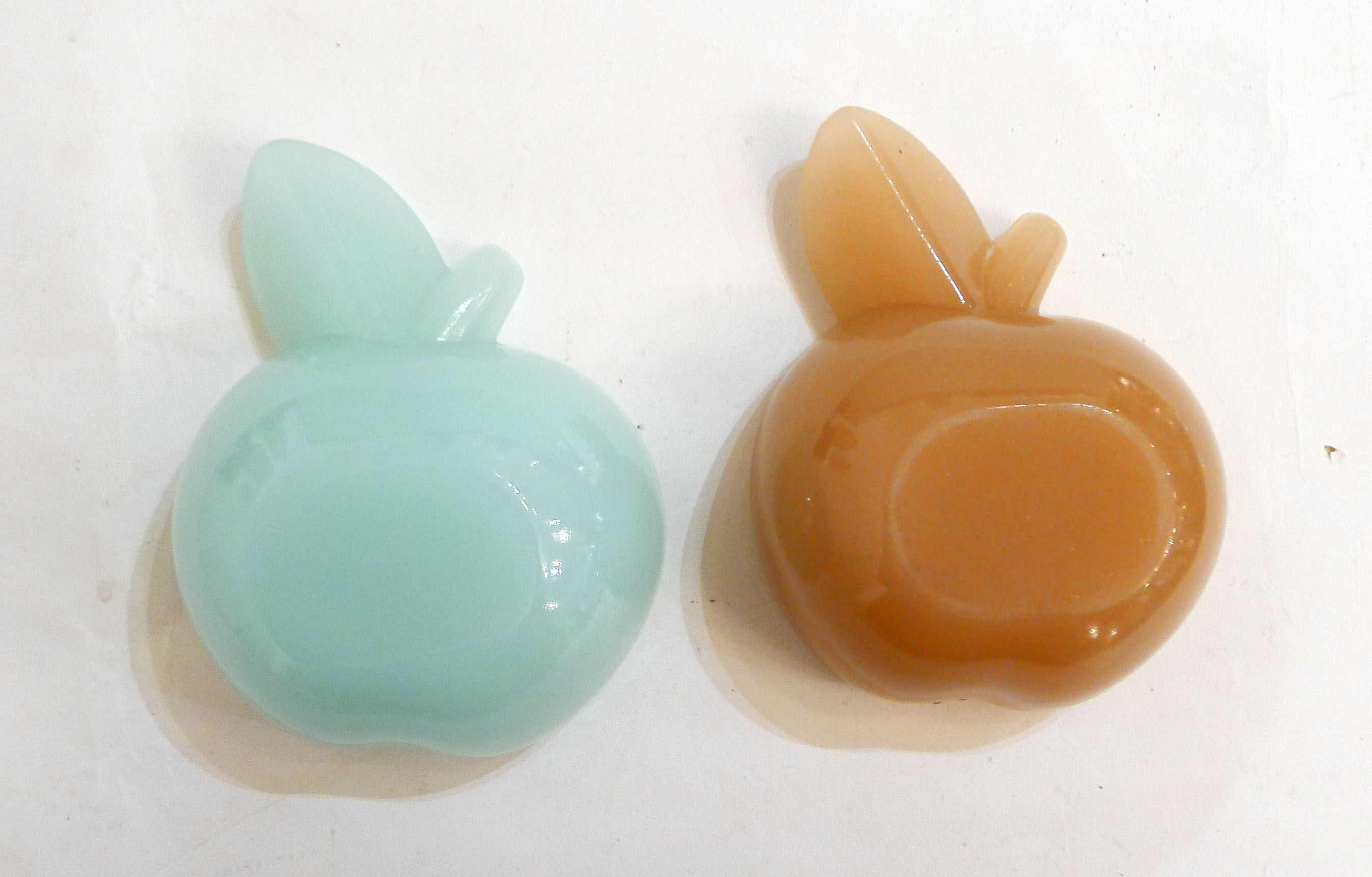 Pair of Apple opalin ashtrays