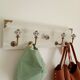 Wall-mounted coat rack 50 cm – 4 hooks and decorative central button