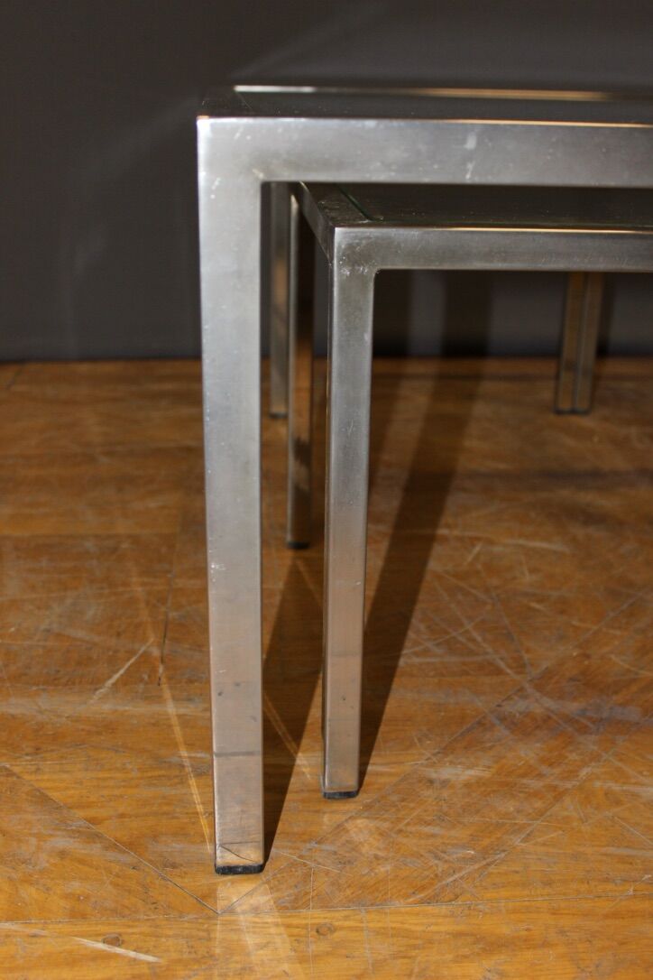 Coffee table and its steel and glass wiggles around 1970