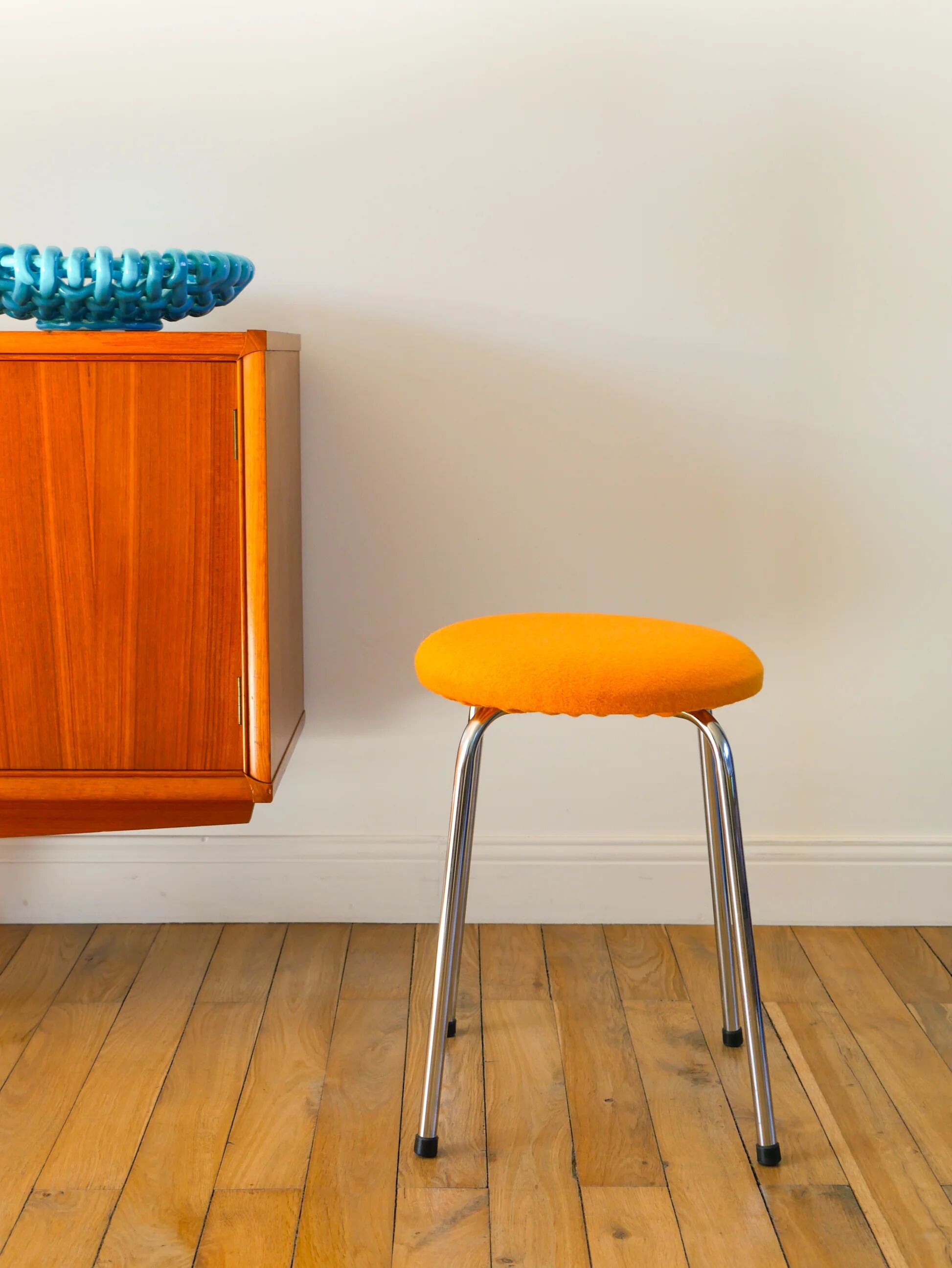 Chrome and boiled wool stool, orange, 1970.