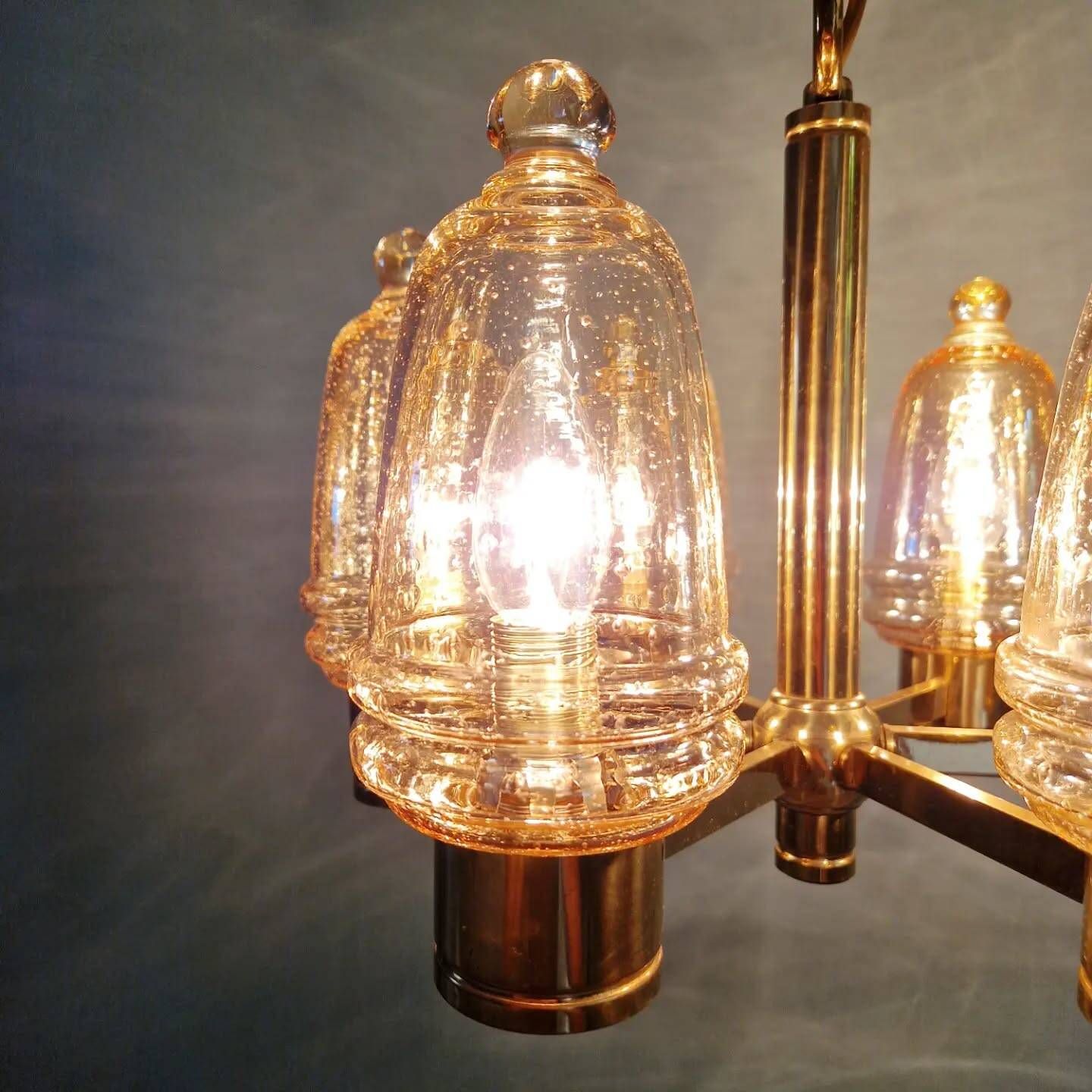 Brass chandelier with amber bubbled glass globes, 1970.