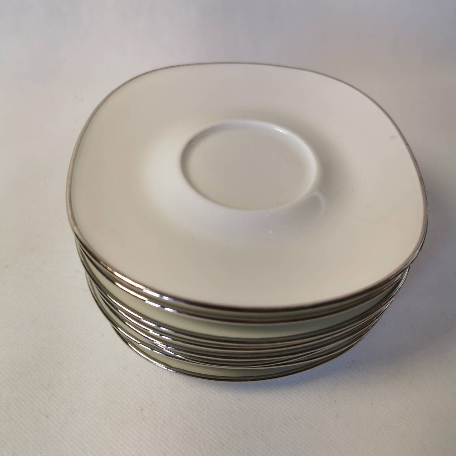 Set of 8 Georges Boyer Limoges porcelain saucers