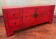 Antique Chinese red lacquered low cabinet
