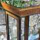 Pair of display cases in magnifying glass and black & gold lacquer, 20th century period