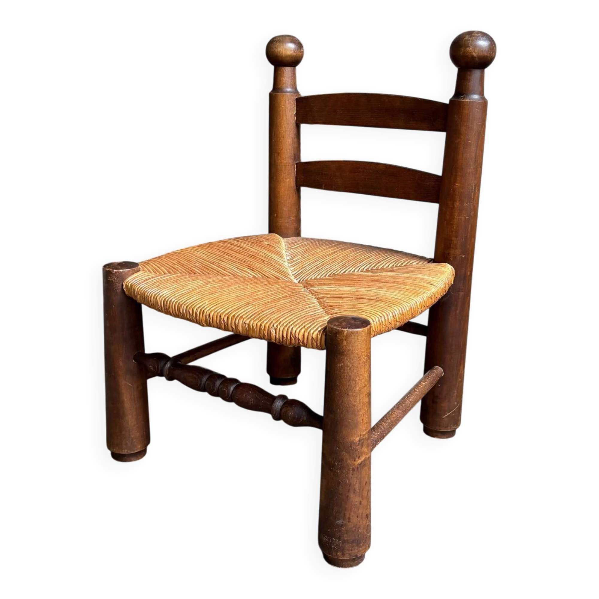 Brutalist low chair in dark wood and straw no. 1