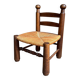 Low brutalist chair in dark wood and straw n°1