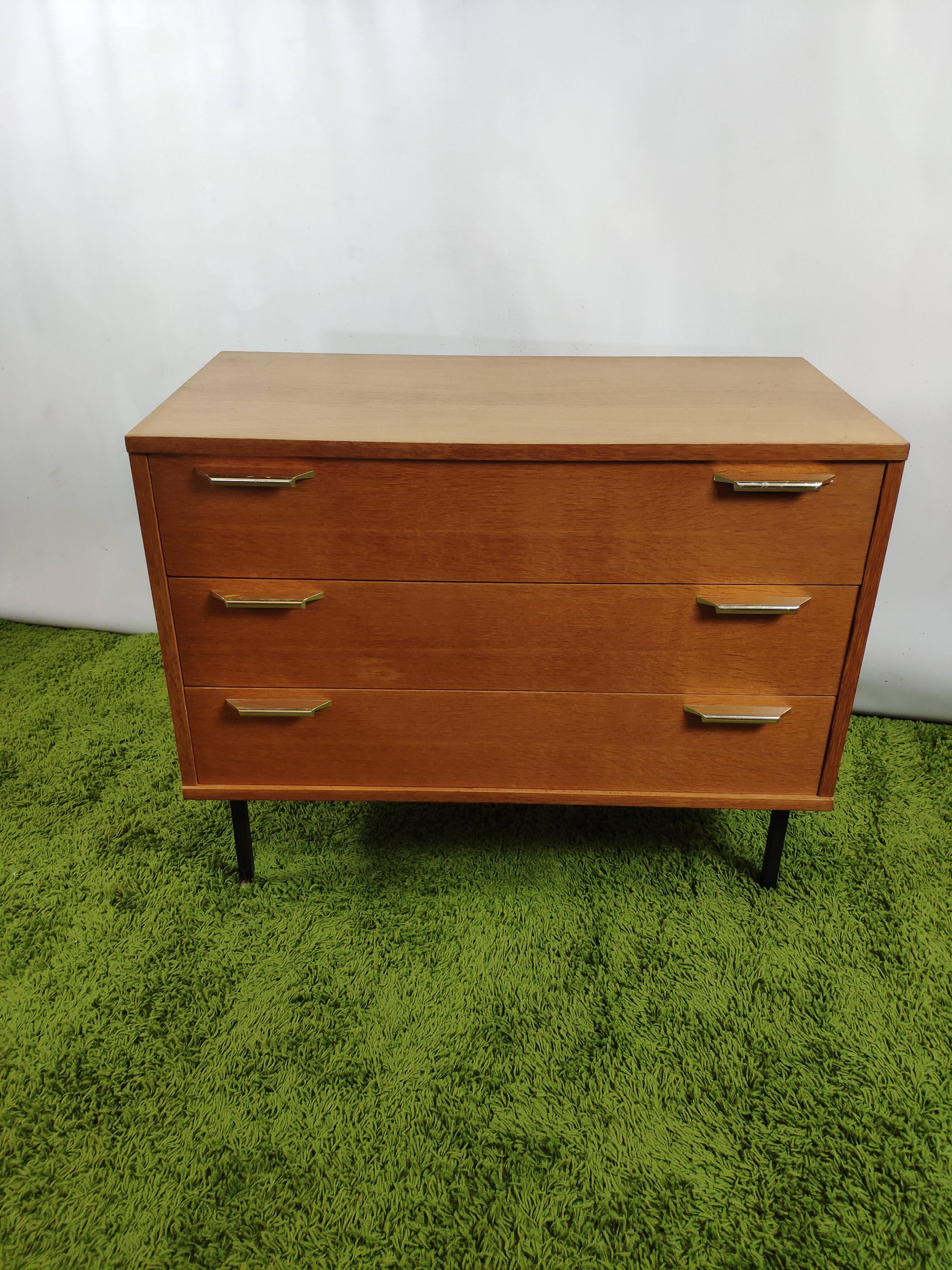 Wooden chest of drawers with gilded handle