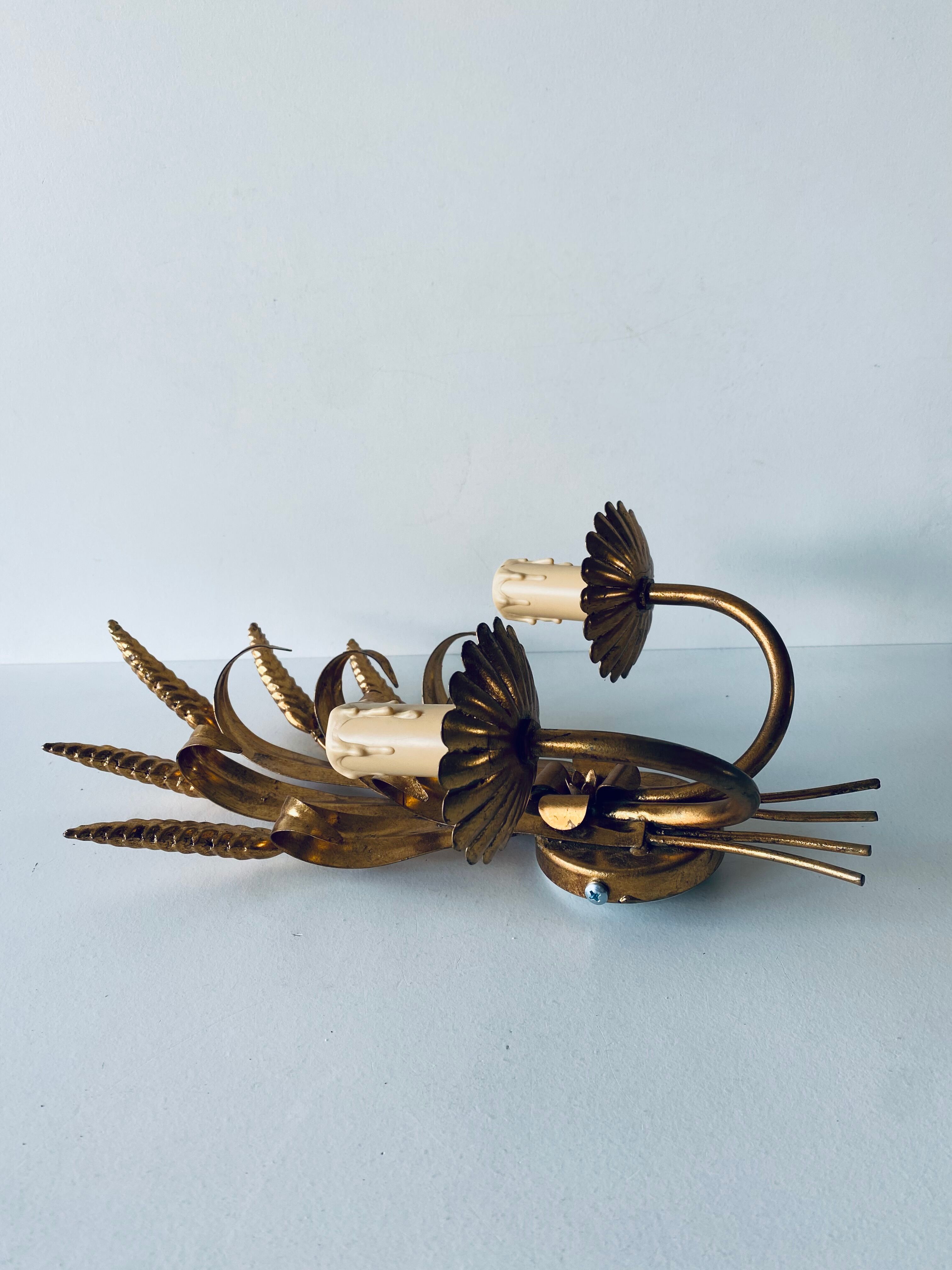 Double golden spike wall lamp