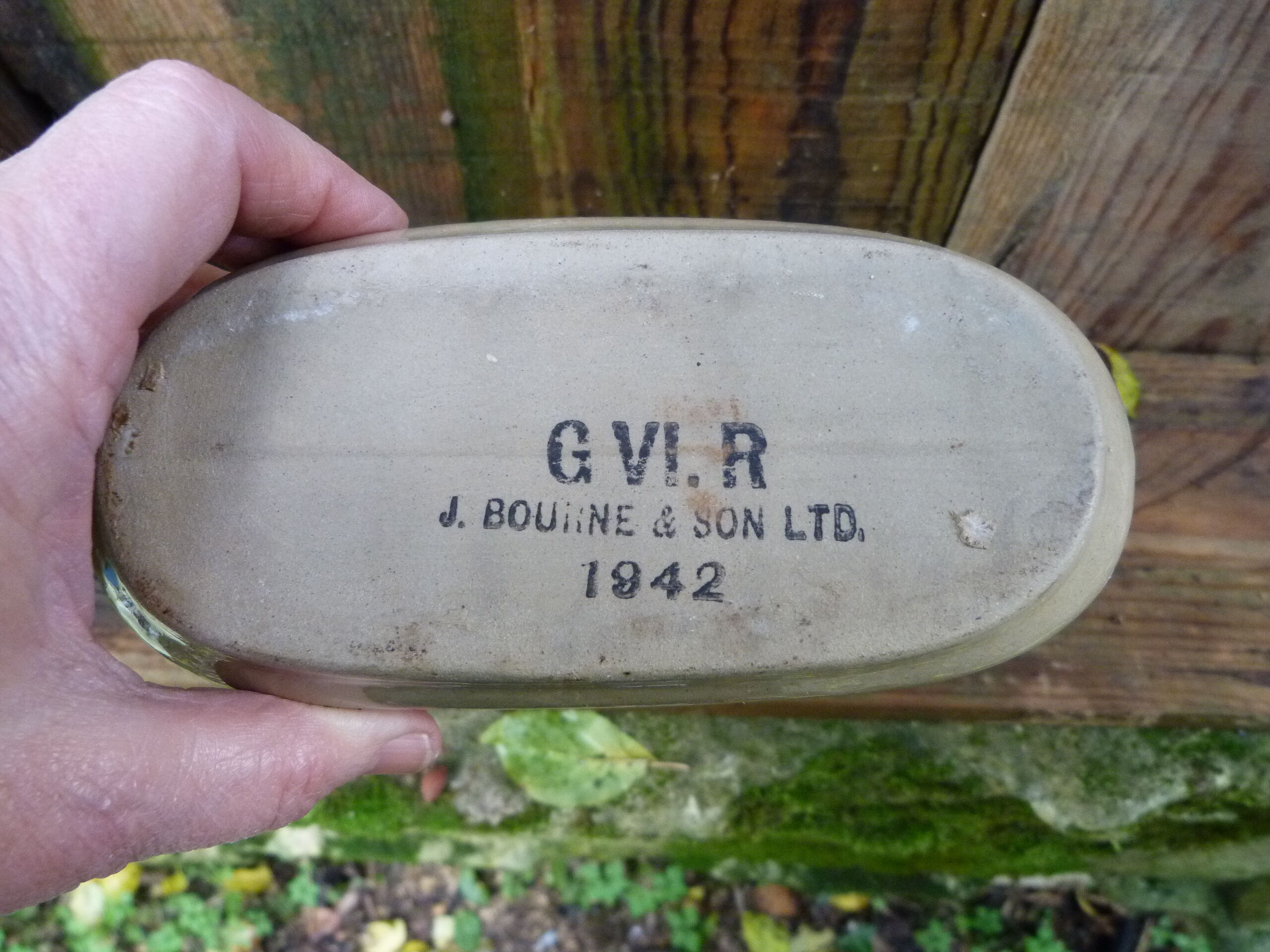 English sandstone hot water bottle dated 1942