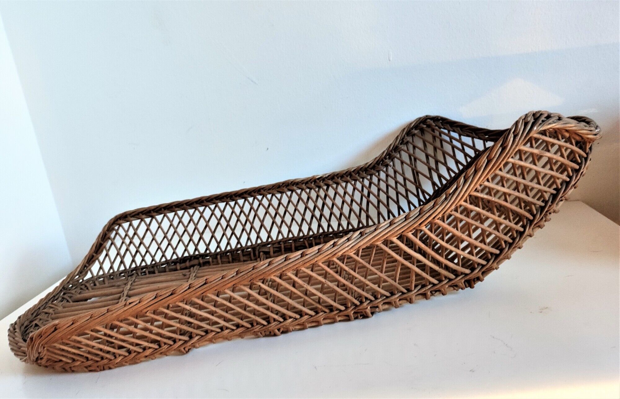 Rattan wicker woven bamboo bassinet or vintage bread pan