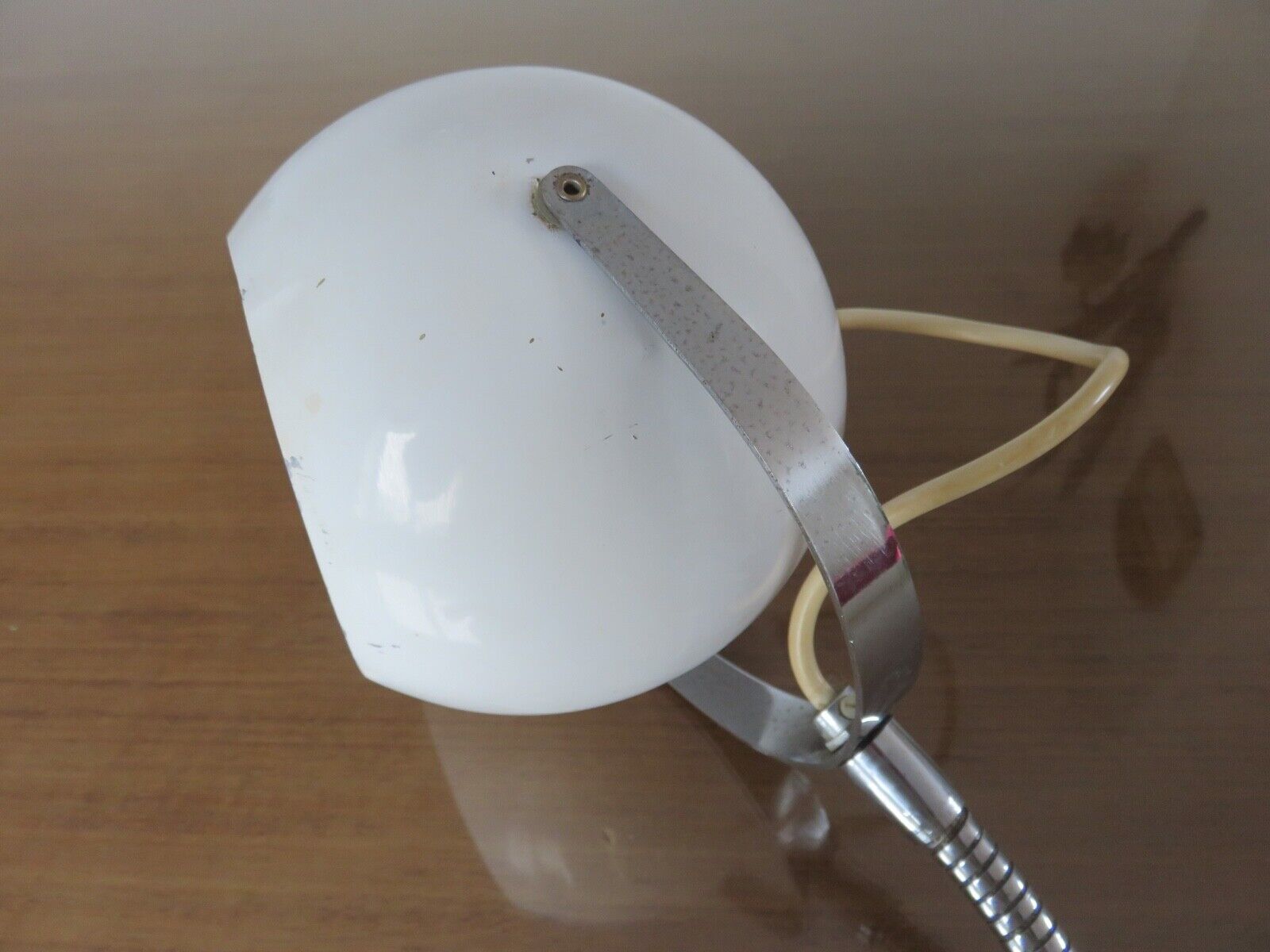 Eye ball lamp stapled on a chrome hose 70s