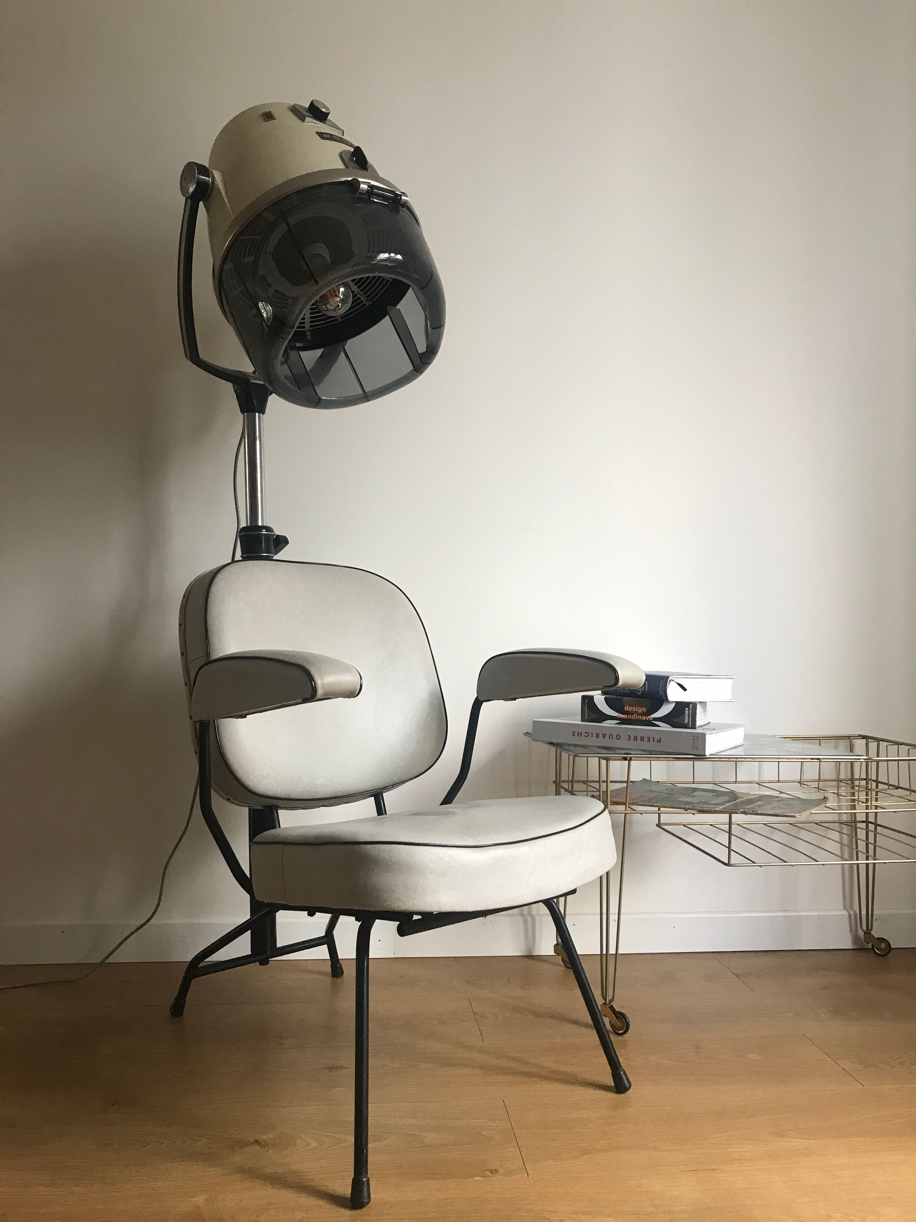 Vintage hairdresser's armchair with helmet transformed into a lamp
