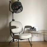 Vintage hairdresser's armchair with helmet transformed into a lamp