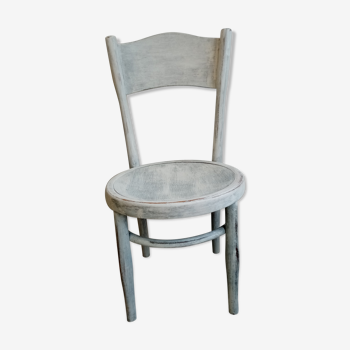 White antique children's chair in patinated wood