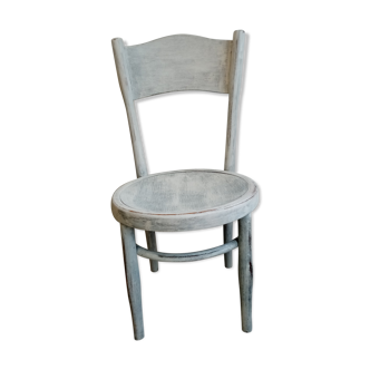 White antique children's chair in patinated wood