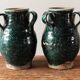 Set of two Chinese green glazed stoneware storage jars.