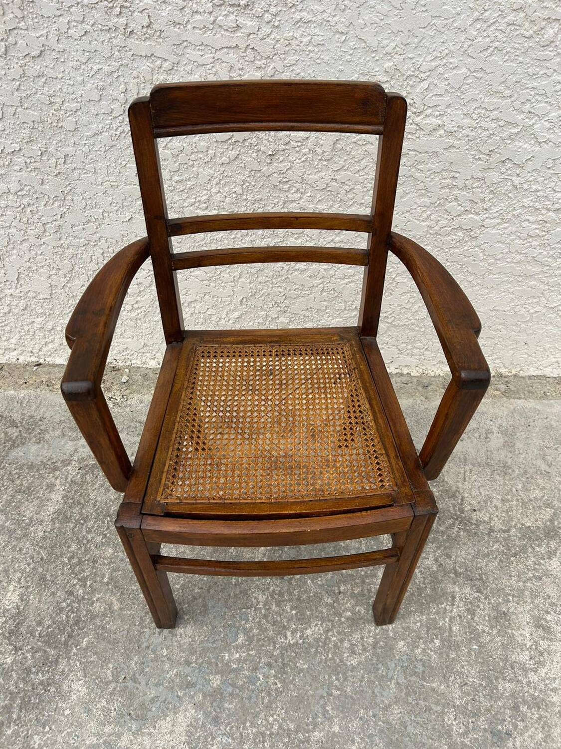 Cane armchair with armrests