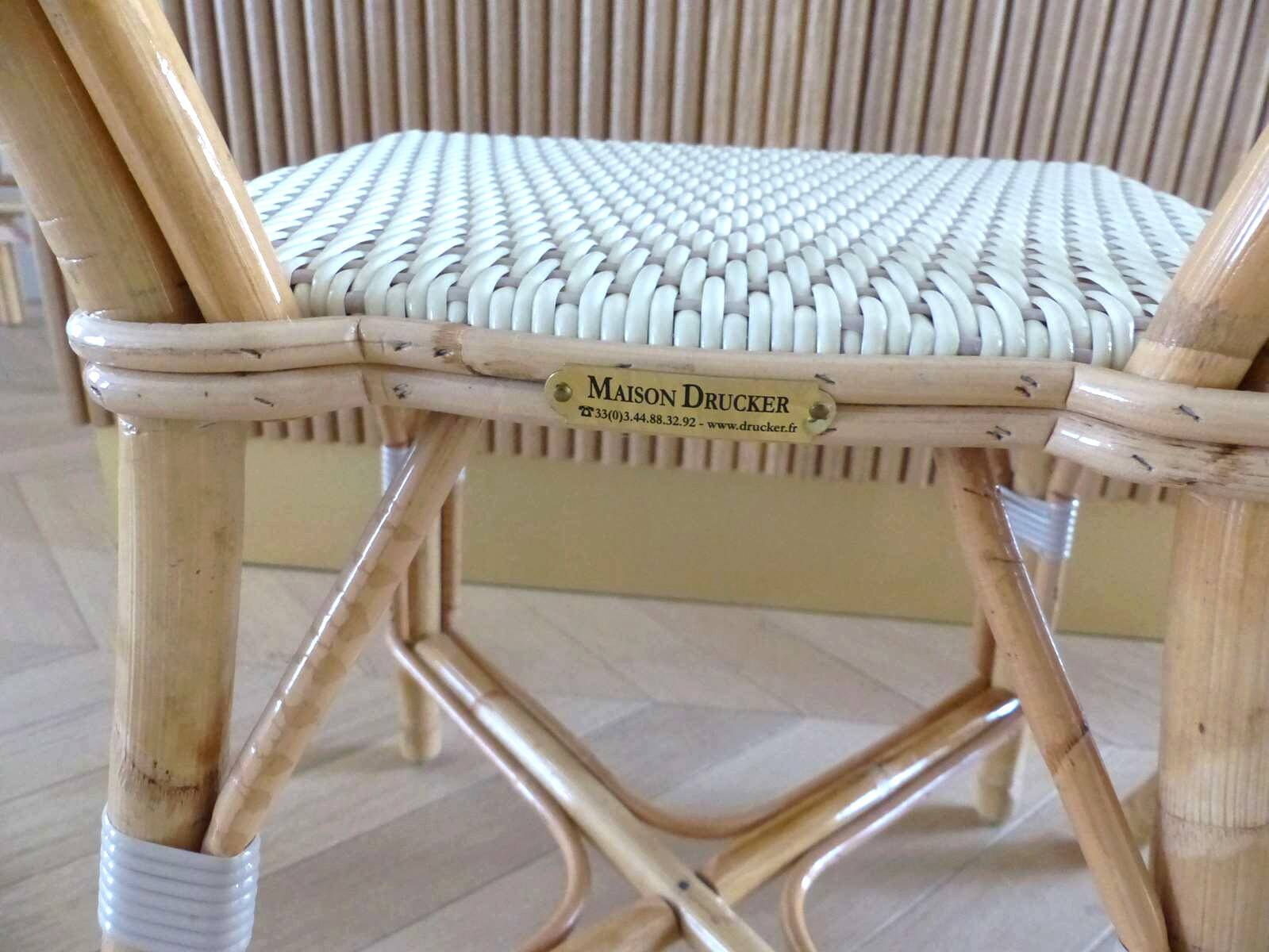 Pair of Parisian bistro chairs from Maison Louis Drucker in light Manila rattan.
