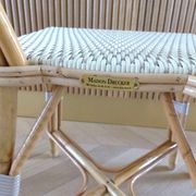 Pair of Parisian bistro chairs from Maison Louis Drucker in light Manila rattan.