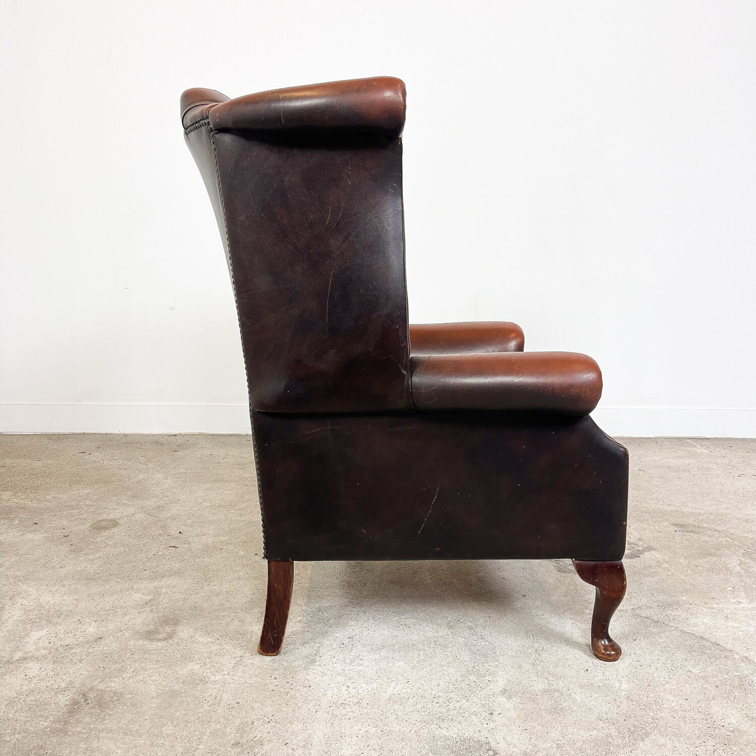 Vintage rustic dark brown leather chesterfield wingback armchair wassenaar