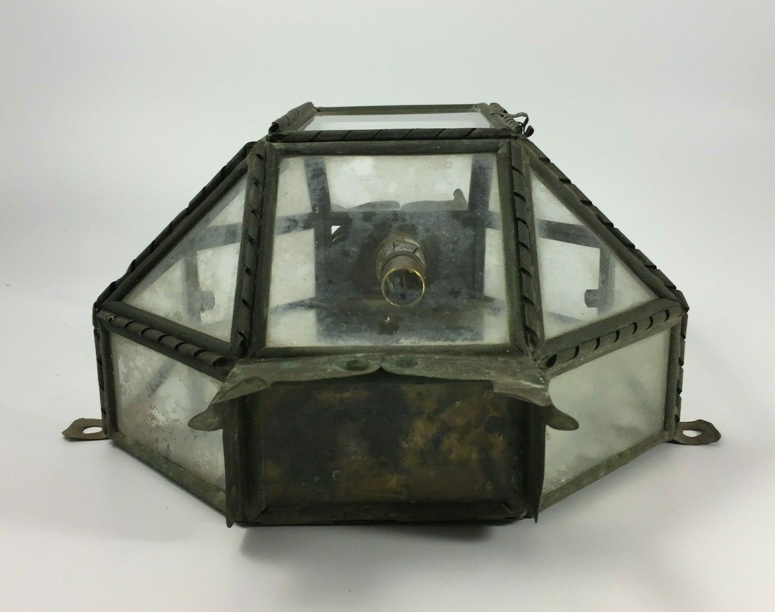 Metal and brass wall light with mirror background 1900