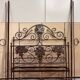 Venetian bed in iron and cast iron from the Art Nouveau period with polychrome decorations