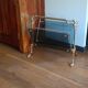 1950s bronze and tinted glass magazine rack with clawed feet