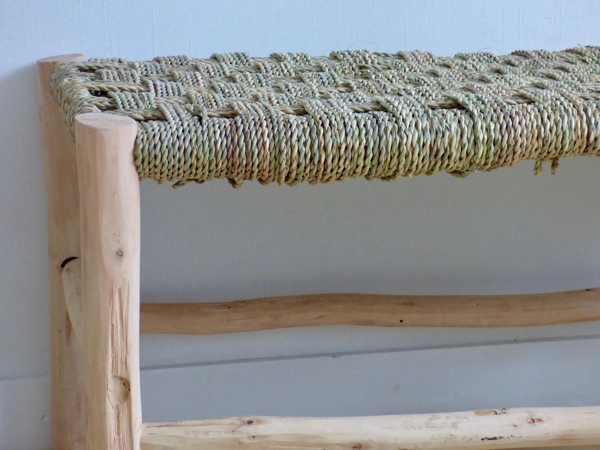 Lemon tree wood bench and braided palm leaf