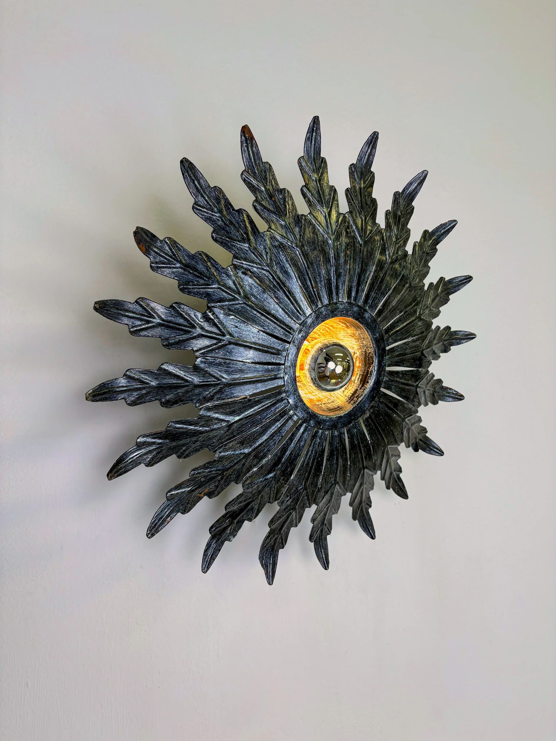 Spanish sunburst ceiling light – dark gilt metal rays, 1950s