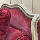 Louis XV style daybed in painted wood and covered with a red velvet