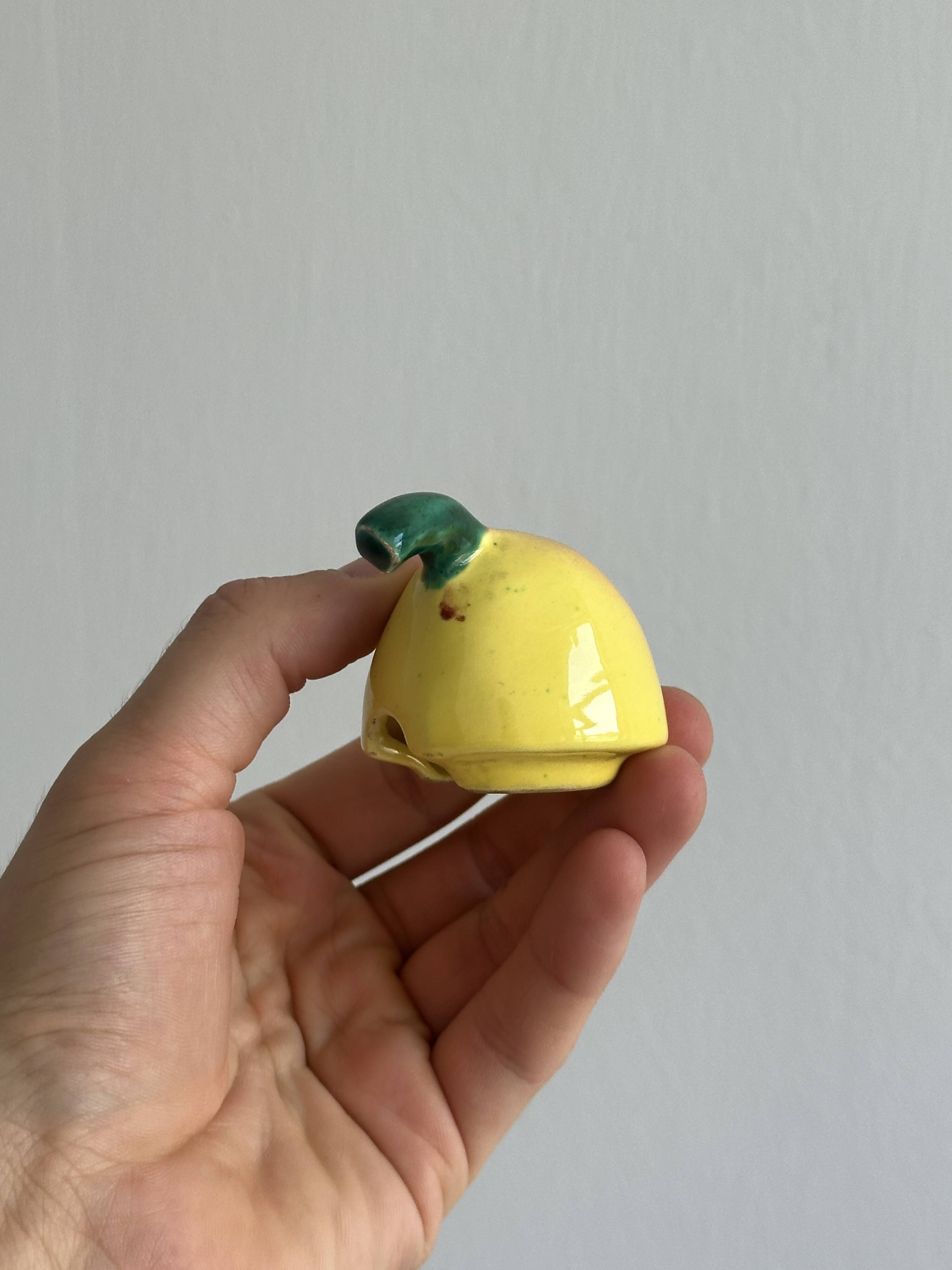 Yellow ceramic pear-shaped salt shaker