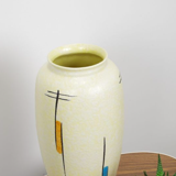 Vintage vase in light yellow porcelain