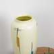 Vintage vase in light yellow porcelain