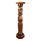 Large decorative column in richly carved wood