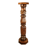 Large decorative column in richly carved wood