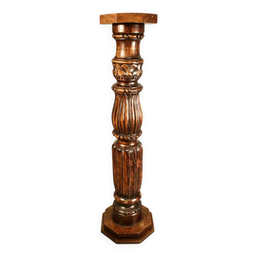 Large decorative column in richly carved wood