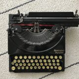 Machine à écrire remington portable en état de marche