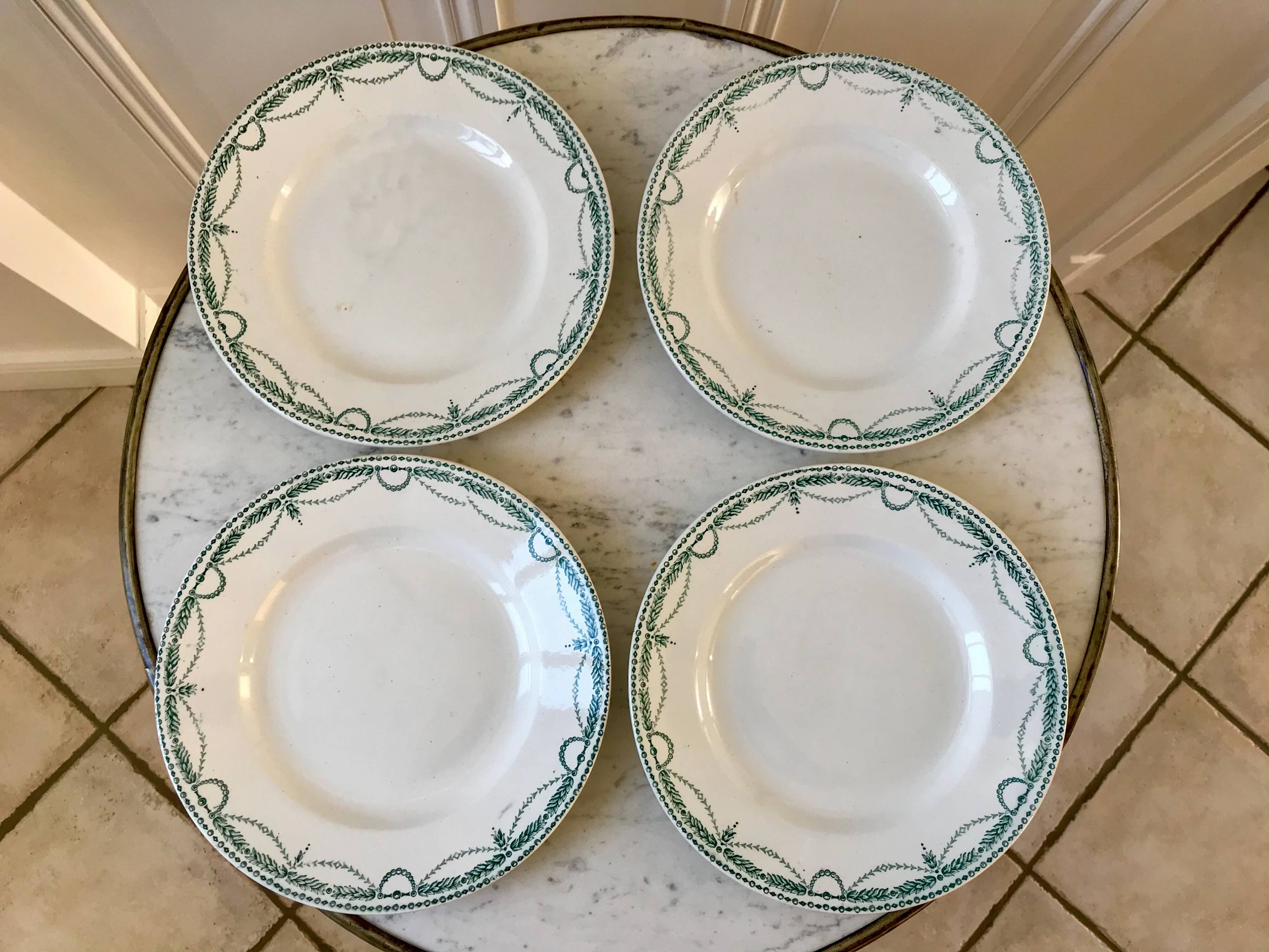 set of 4 flat plates in Terre de Fer Saint Amand model René 19th century