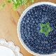 Pie dish on foot, in slip with blackberry decoration