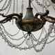 Louis XVI style chandelier with a pearl garland and painted tin, 20th century.