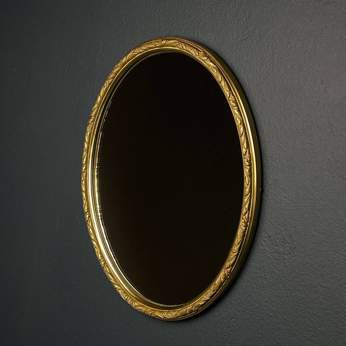 Vintage mirror in a brass frame, Italy, 1950s.